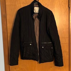 Lined quilted black Jacket.